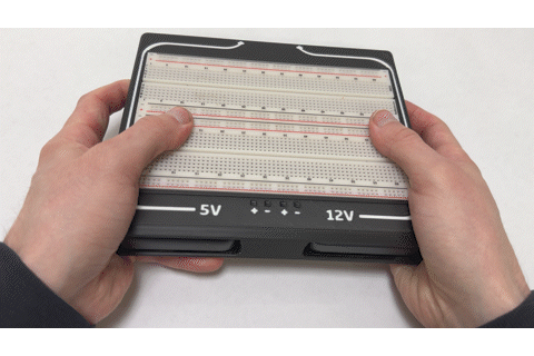 Removing a power bank Pushing a power bank out of the Battery Breadboard through the side cutout