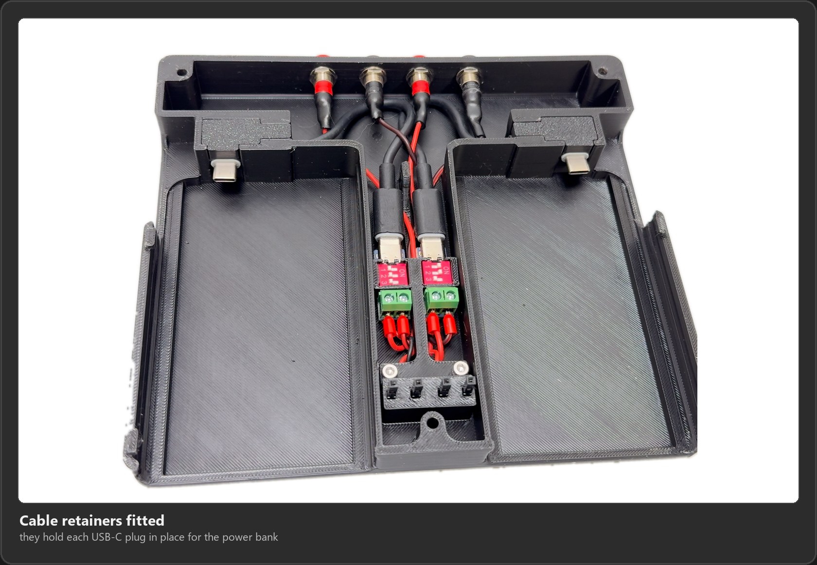 The cable retainers fitted over the USB-C plugs at the end of each battery bay