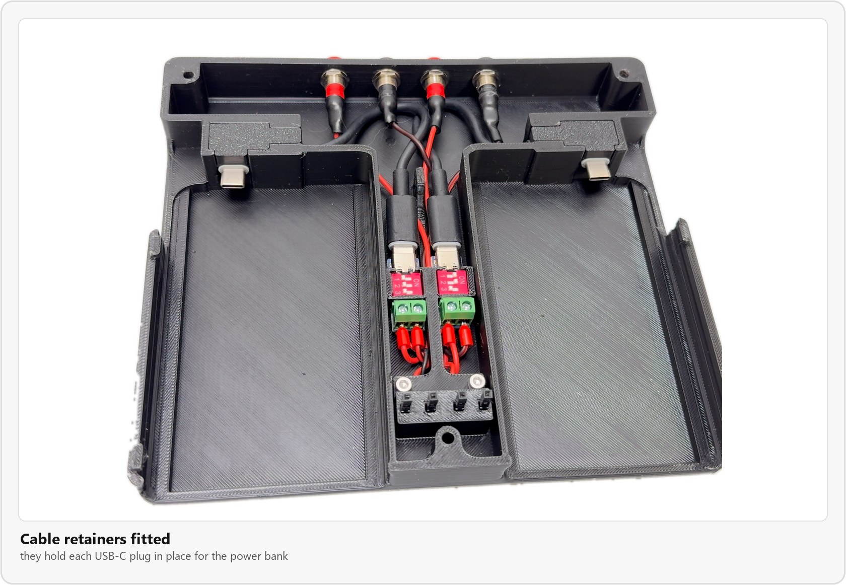 The cable retainers fitted over the USB-C plugs at the end of each battery bay