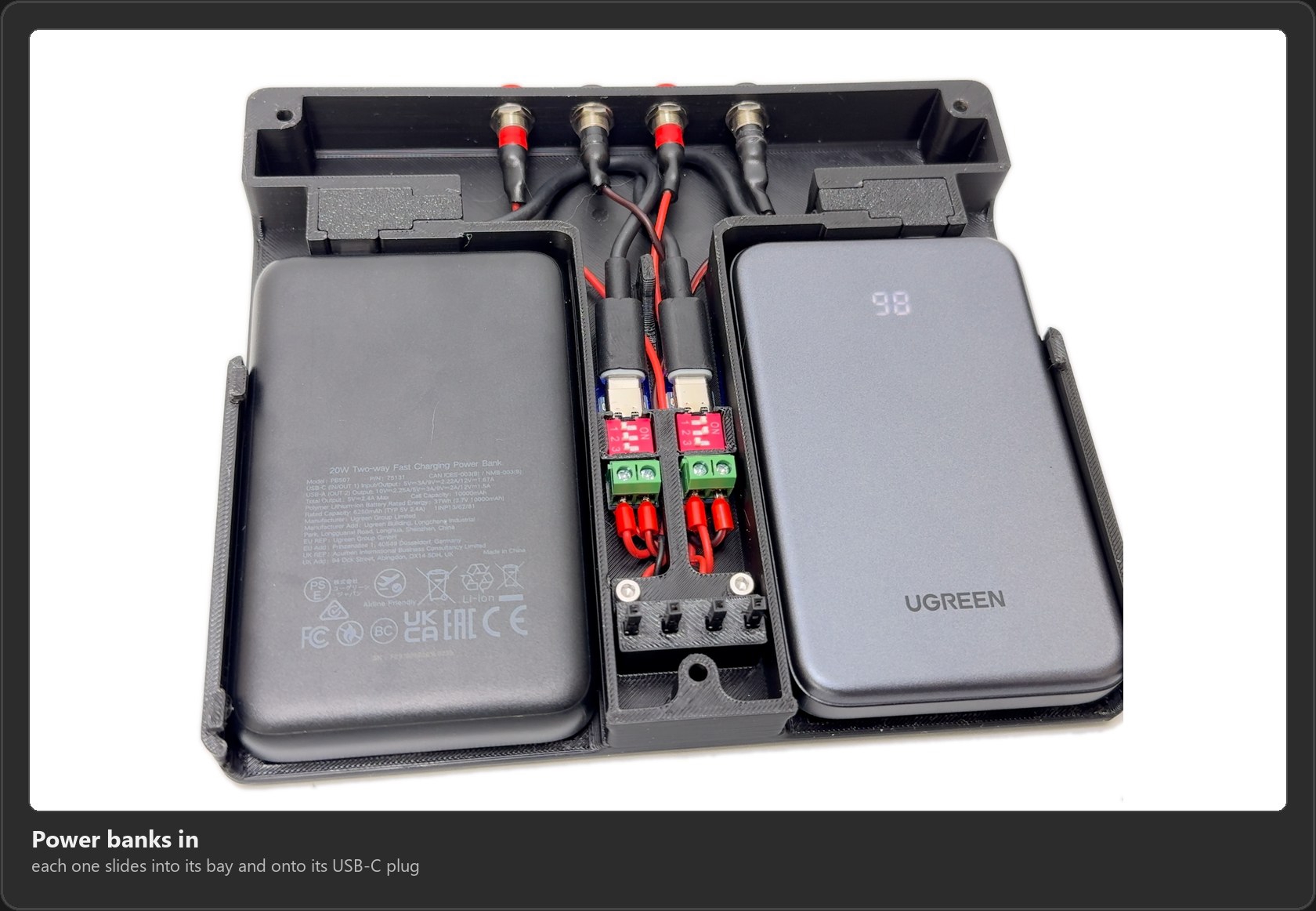 Both power banks installed in their bays, plugged into the USB-C cables, with the PD module assembly between them