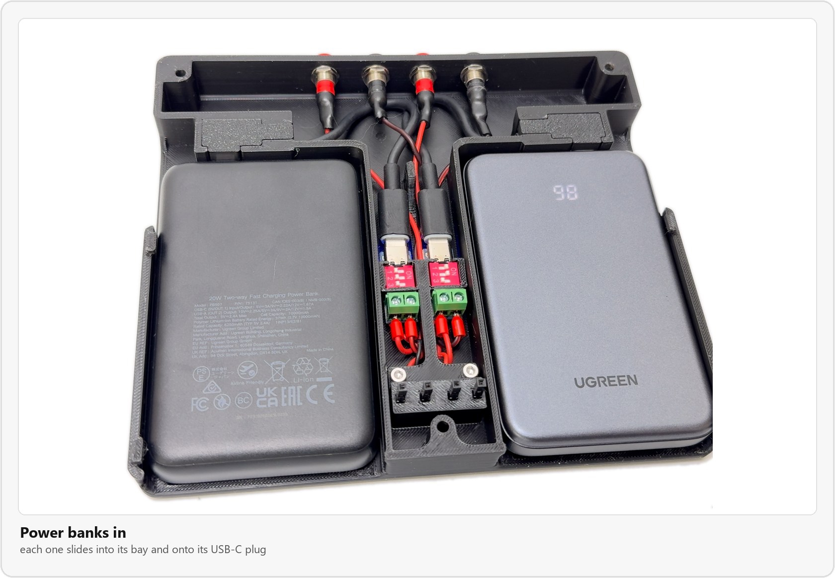 Both power banks installed in their bays, plugged into the USB-C cables, with the PD module assembly between them